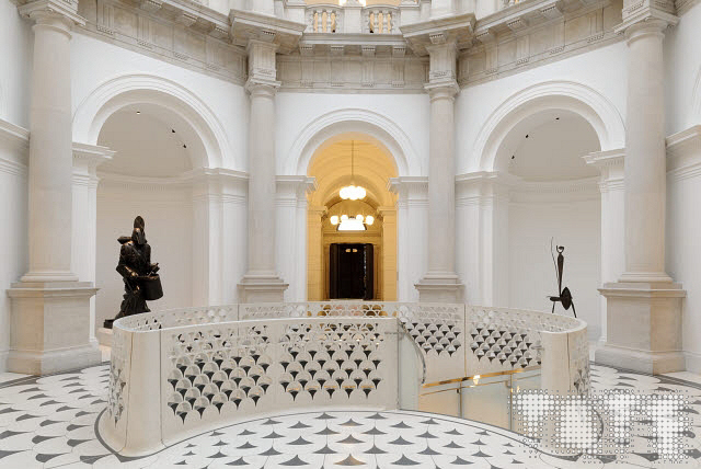 a large building with a clock on a table