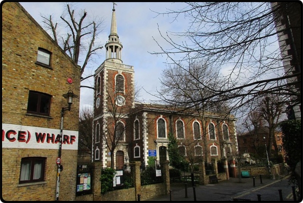 a church with a clock on the side of a building