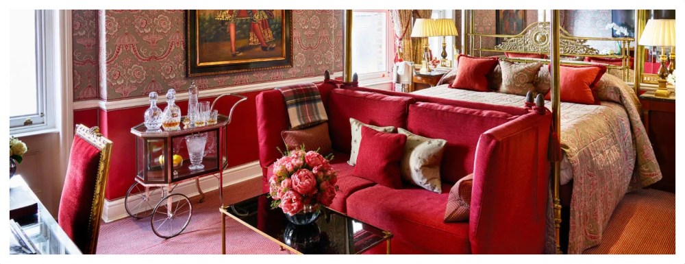a living room filled with furniture and a fire place sitting in a chair