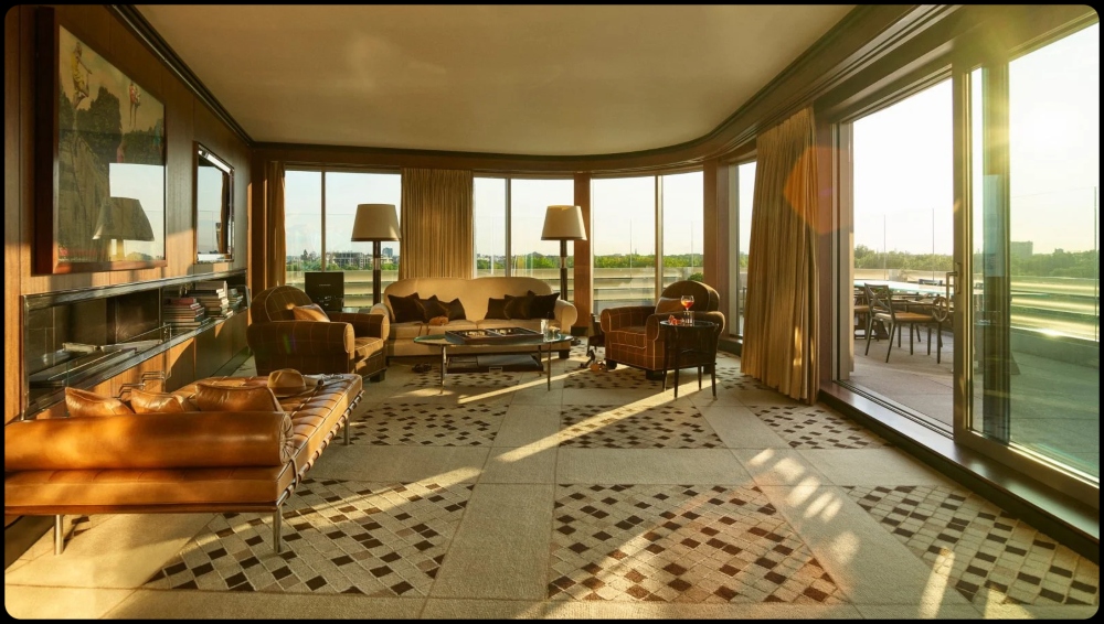 a view of a living room filled with furniture and a large window