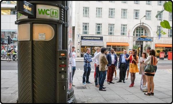 a group of people standing in front of a building