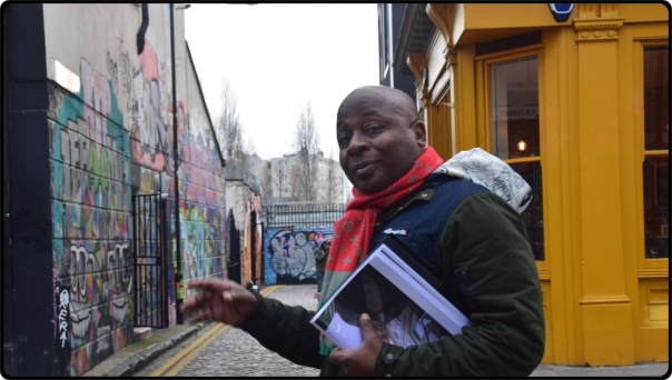 Vas Blackwood standing in front of a building