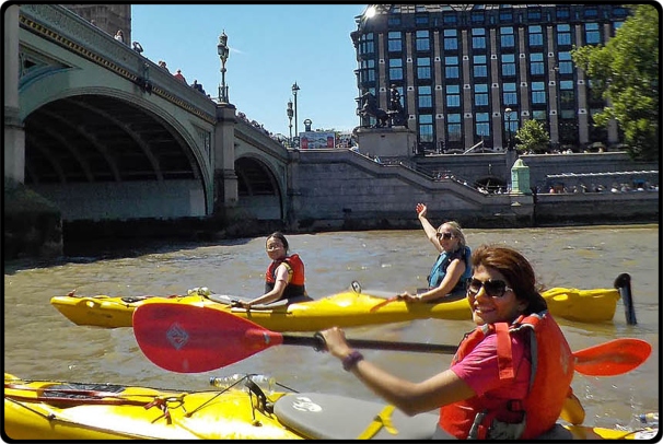 a group of people riding on the back of a boat